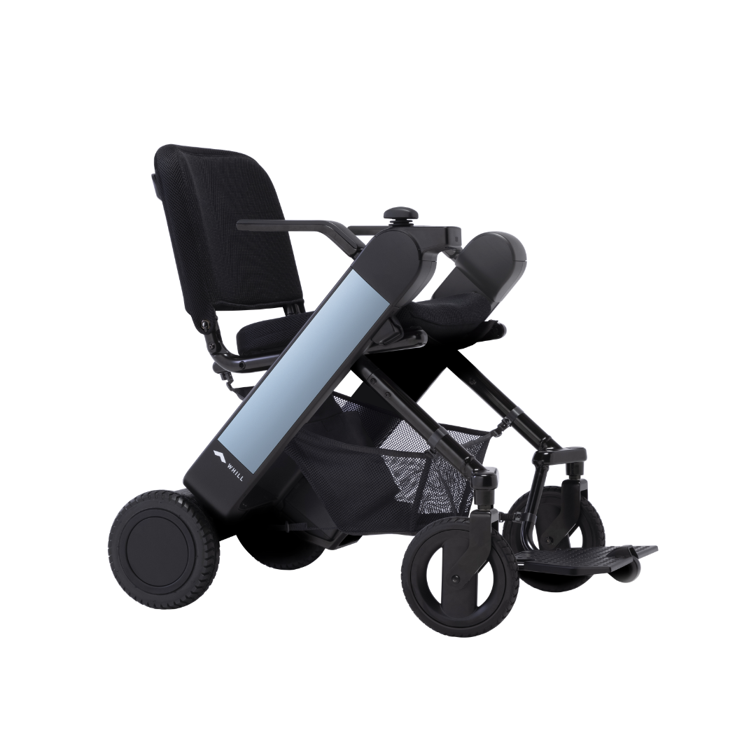 The Whill Model F Lightweight Portable Electric Wheelchair features a sleek black design with large rear wheels, small front wheels, armrests, mesh storage under the seat, and a footrest. Review specs to ensure it fits your needs.